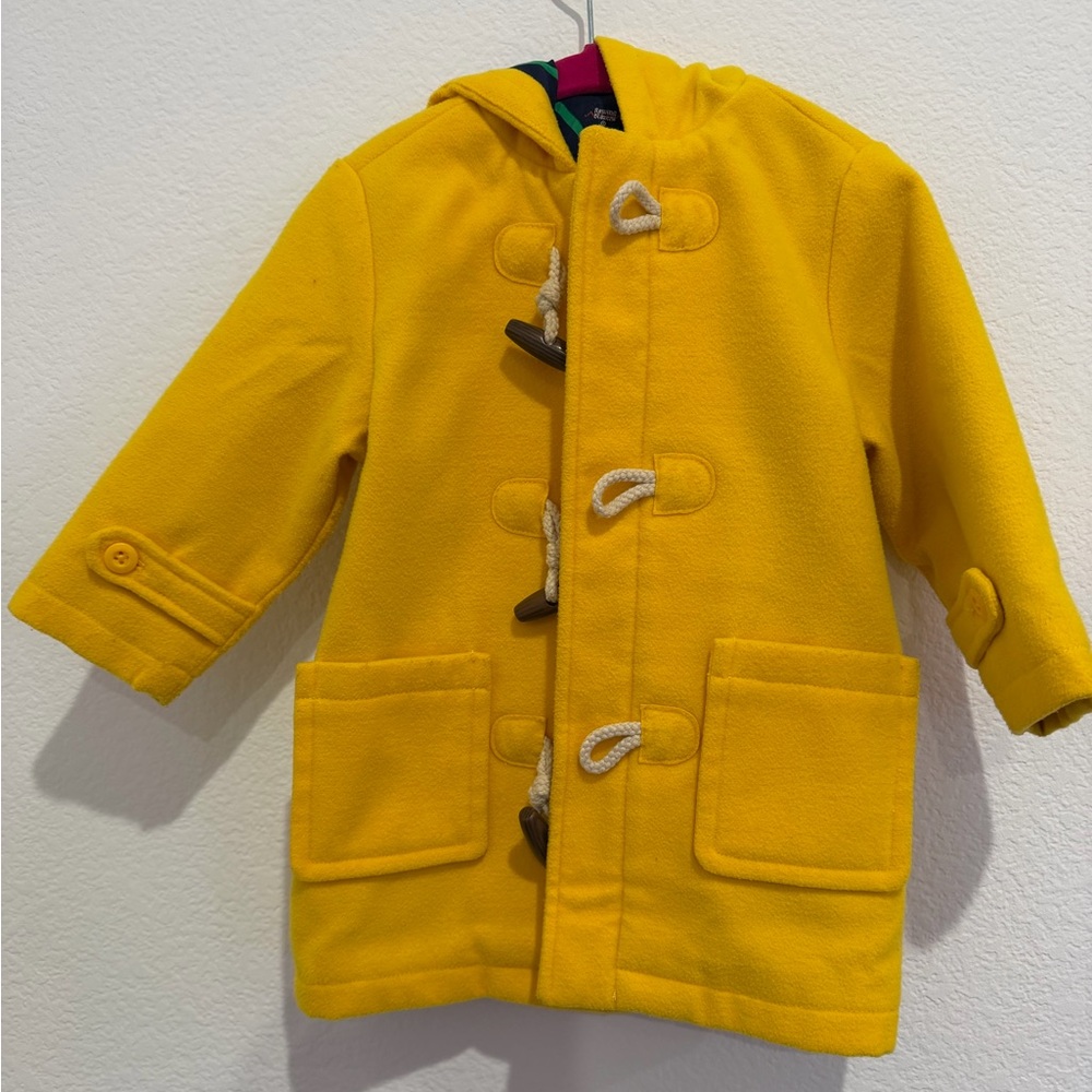 Hooded wool coat with zipper and toggle. Rowing Blazers.